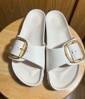 Birkenstock White Slide Sandals with Gold Buckle thumbnail 1
