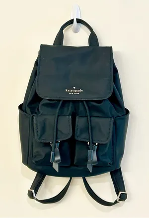 Kate Spade New York Carly Flap Drawstring Backpack in Black Technical Nylon thumbnail 1