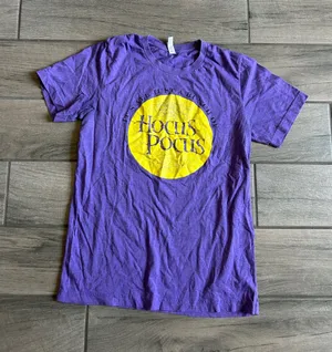 Bella Canvas Purple Short Sleeve Tee with Yellow 'Hocus Pocus' Graphic thumbnail 1