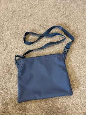 Herschel navy blue crossbody bag with red/white striped lining thumbnail 2