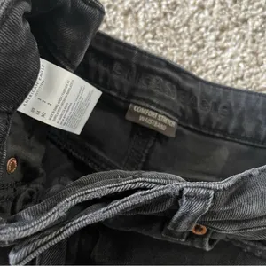 American Eagle Super Destroyed Black High Rise Mom Distressed Denim jean shorts thumbnail 4