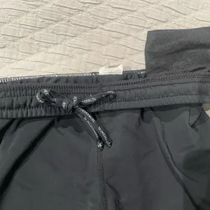 Brooks Women’s Fitted Black Athletic Running Shorts with drawstring and Logo thumbnail 3