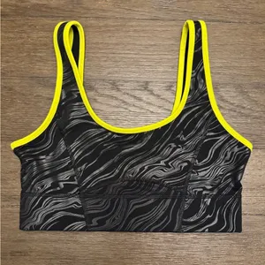 Fabletics neon yellow and black size medium sports bra thumbnail 1