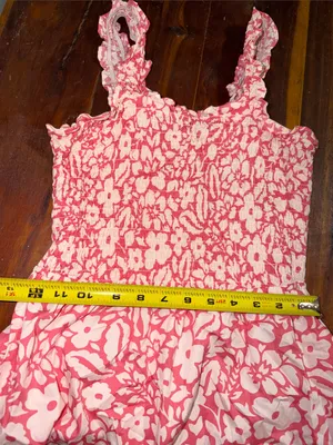 pink and white floral smocked sundress from the boutique brand Versona thumbnail 6