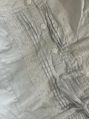 Baby blue Brandy Melville Maeve lace cami top with button-up front and ruffled hem thumbnail 2