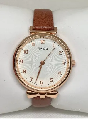 Women’s quartz analog watch gold tone 34mm round case brown leather band running thumbnail 1