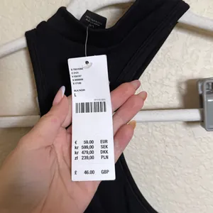 Urban Outfitters Asymmetrical Halter Neck Ribbed Flare Jumpsuit Sz L NEW black‎ thumbnail 4