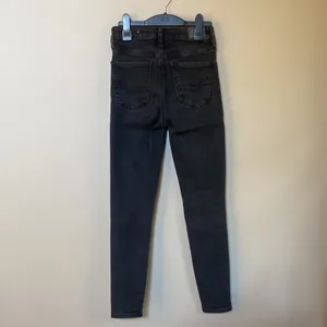 American Eagle super hi rise black distressed ripped skinny jeans thumbnail 5