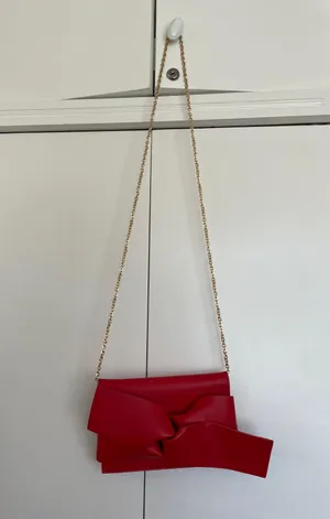Red Clutch Bag With Bow And Gold Chain thumbnail 1