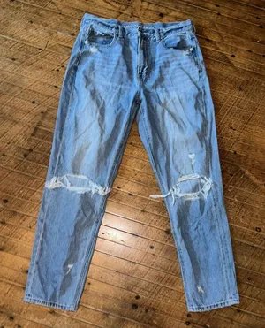 American Eagle light wash destroyedrelaxed mom jeans thumbnail 1