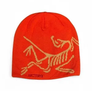 orange and yellow arcteryx bird head toque beanie thumbnail 1