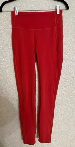 Vuori Women's Orange stride ziper pocket Leggings size XS thumbnail 1
