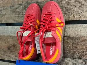 Adidas handball poles in a pretty red with light orange stripes thumbnail 3