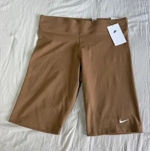 Nike Women's Tan Bike Shorts with White Swoosh thumbnail 1