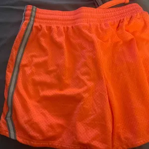 Nike Vibrant Orange Mesh Shorts with Silver Stripes thumbnail 4