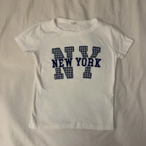 Brandy Melville New York Baby Tee John Galt thumbnail 1
