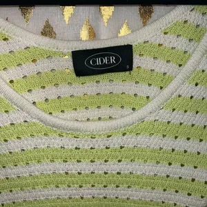 Cider green and white striped pointelle knit short-sleeve sweater with scalloped thumbnail 3