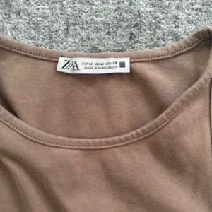 Zara Sleeveless Ribbed High-Neck Tank Top in Tan thumbnail 4