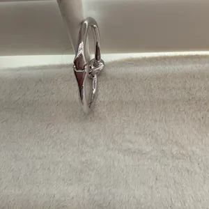 Silver plated knotted bangle thumbnail 5