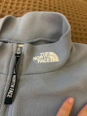 light blue north face woman’s quarter zip turtle neck vest in a size L thumbnail 2