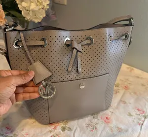 Michael Kors perforated bucket-style bag in gray thumbnail 1