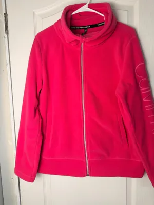 Calvin Klein fleece teddy jacket in vibrant hot pink. Full-zip front with stand collar. Side pockets for hands. Subtle branded detail on the sleeve. Soft, cozy finish for everyday wear. thumbnail 2