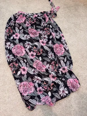 Flowy maxi Serong with an all-over pink floral pattern. Tie-waist detail for a customizable fit. Lightweight, breezy fabric for beach or pool wear. Feminine floral design ideal for vacation days. thumbnail 1