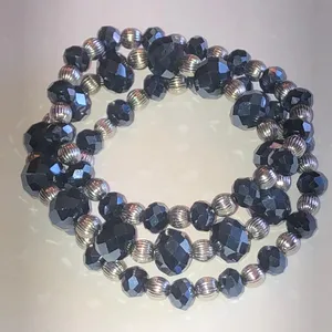 Black Metallic Faceted Bead Stretch Bracelet with Silver Tone Accent Beads thumbnail 1