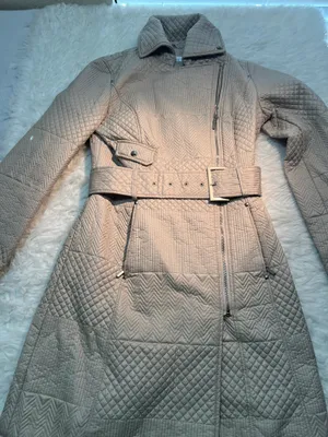 XS beige Kenneth Cole quilted trench coat features a belted waist and a diagonal zip closure. thumbnail 1