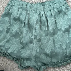 Sage green dressy shorts with lace trim thumbnail 4