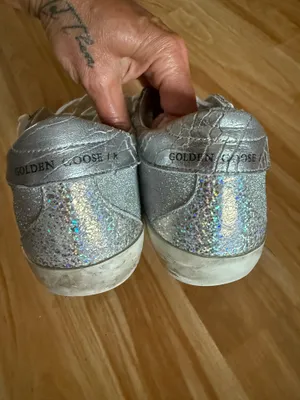 GOLDEN GOOSE Super-Star Iridescent and Glitter Leather Sneakers - Sz 38 - US 7 1/2 These are in good condition with light wear throughout. They are a pretty hard to find but super cute style. They have like holographic leather and glitter areas. Please see pics for details. Metallic leather upper Round toe Lace-up closure White leather star Cushioned insole; unlined Rubber sole Made in Italy thumbnail 10