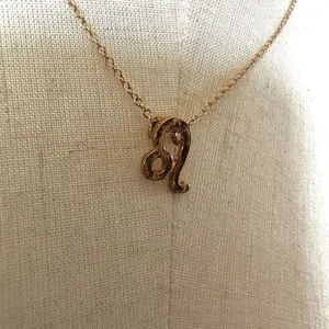 Leo zodiac sign gold tone pendant necklace thumbnail 3
