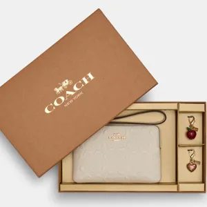 Authentic COACH EMBOSSED LOGO ZIP WALLET /2 CHARMS❤️❤️‍🔥 thumbnail 1