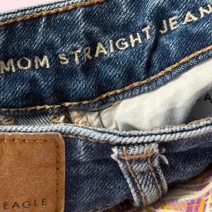 Women’s American Eagle Mom Straight Jeans Distressed 000 Regular Cool Torn Blue thumbnail 9