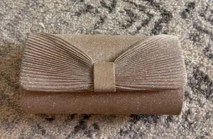 Tan and gold glittery bow clutch thumbnail 1