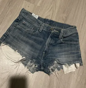 Levi's Distressed Dark Blue Denim Cutoff Shorts thumbnail 1