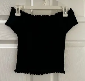 Brandy Melville black off-the-shoulder smocked crop top thumbnail 1
