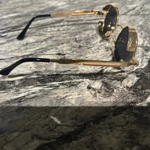 Round Gold and Black Sunglasses thumbnail 6