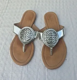 Coach Women’s Size 6B Silver Metallic Thong Sandals Logo Medallion Flip Flops thumbnail 1