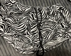 Super cute black & white zebra print fuzzy bottoms 🖤🤍 • Size 11–13 (UG) • Black & white zebra print • Soft/fuzzy material • Adjustable black drawstring waist • Y2K / coquette / edgy aesthetic Perfect with a cropped tank, baby tee, or oversized hoodie! Good used condition — see photos for details. thumbnail 1