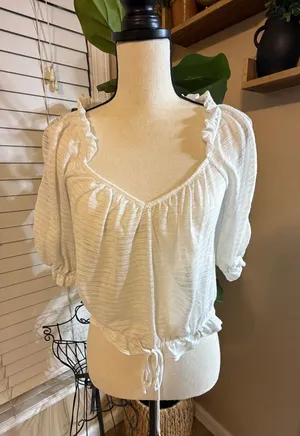 Free People Lightweight floral blouse with long sleeves. Scoop neckline and double tie-front thumbnail 1