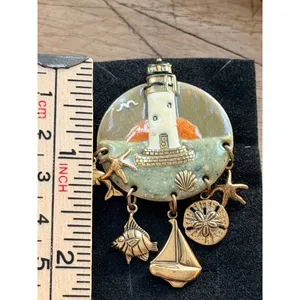 Lighthouse-Themed Enamel Brooch With Nautical Charms & Gold Accents Measures App thumbnail 2