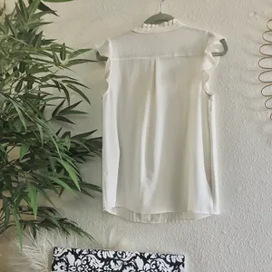 Modcloth vintage inspired sleeveless cami top with neck pleats, button up down, arm sleeve ruffles thumbnail 2