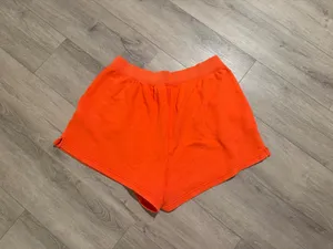 Aerie x Smiley Orange Sweat Shorts - Size XL (Like New) Description: Upgrade your loungewear with these vibrant, bright orange Aerie x Smiley fleece sweat shorts! As seen they feature a comfy elastic waistband, handy side pockets, and a cute "Cabana Beach Club" smiley logo on the left hem. Condition: Excellent, like-new condition with no visible flaws Size: XL / TG Details: Soft fleece lining, perfect for beach days or casual lounging. Close-up of the graphic logo can be found Super cozy and ready for a new home! Fast shipping. thumbnail 4