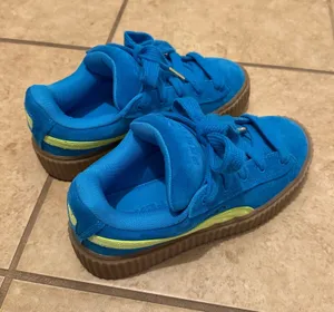 Cobalt Blue Fenty x Puma sneakers with neon yellow accents (discontinued) thumbnail 1