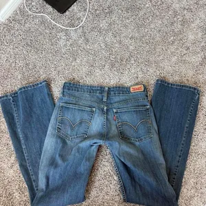 Levi’s 518 Superlow Rise flare jeans in a waist size 27 thumbnail 7
