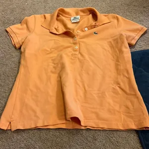Lacoste‎ orange polo 42 thumbnail 1