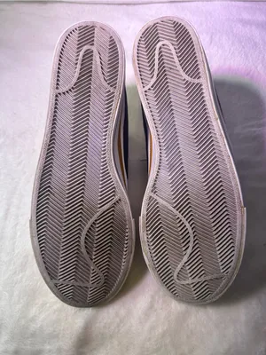 Nike White Sneakers with Black Swoosh and Orange Accent thumbnail 10