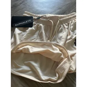 NEW Alphalete Woman’s Varsity Short - Tan ,size XS thumbnail 9
