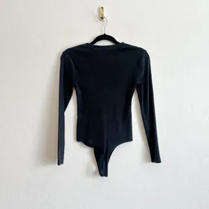 Abercrombie & Fitch | Soft A&F Ribbed Long Sleeve Thong Bodysuit in Black thumbnail 3